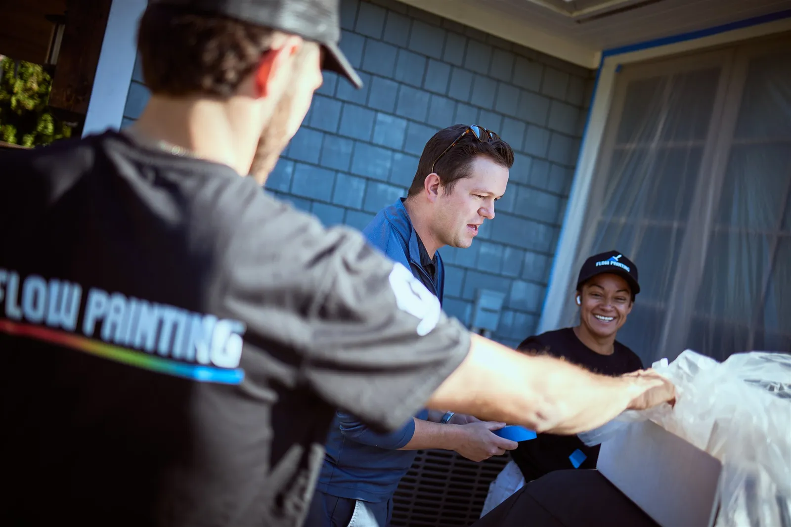 Professional painters working on house exterior painting project in Victoria