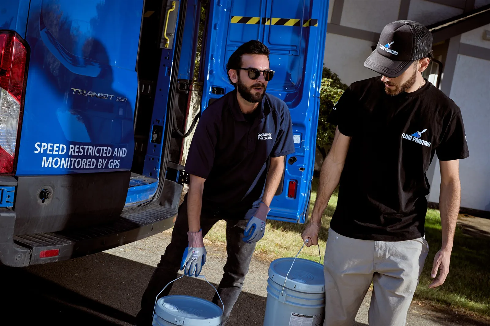 Flow Painting crew applying exterior paint to Victoria BC residential home