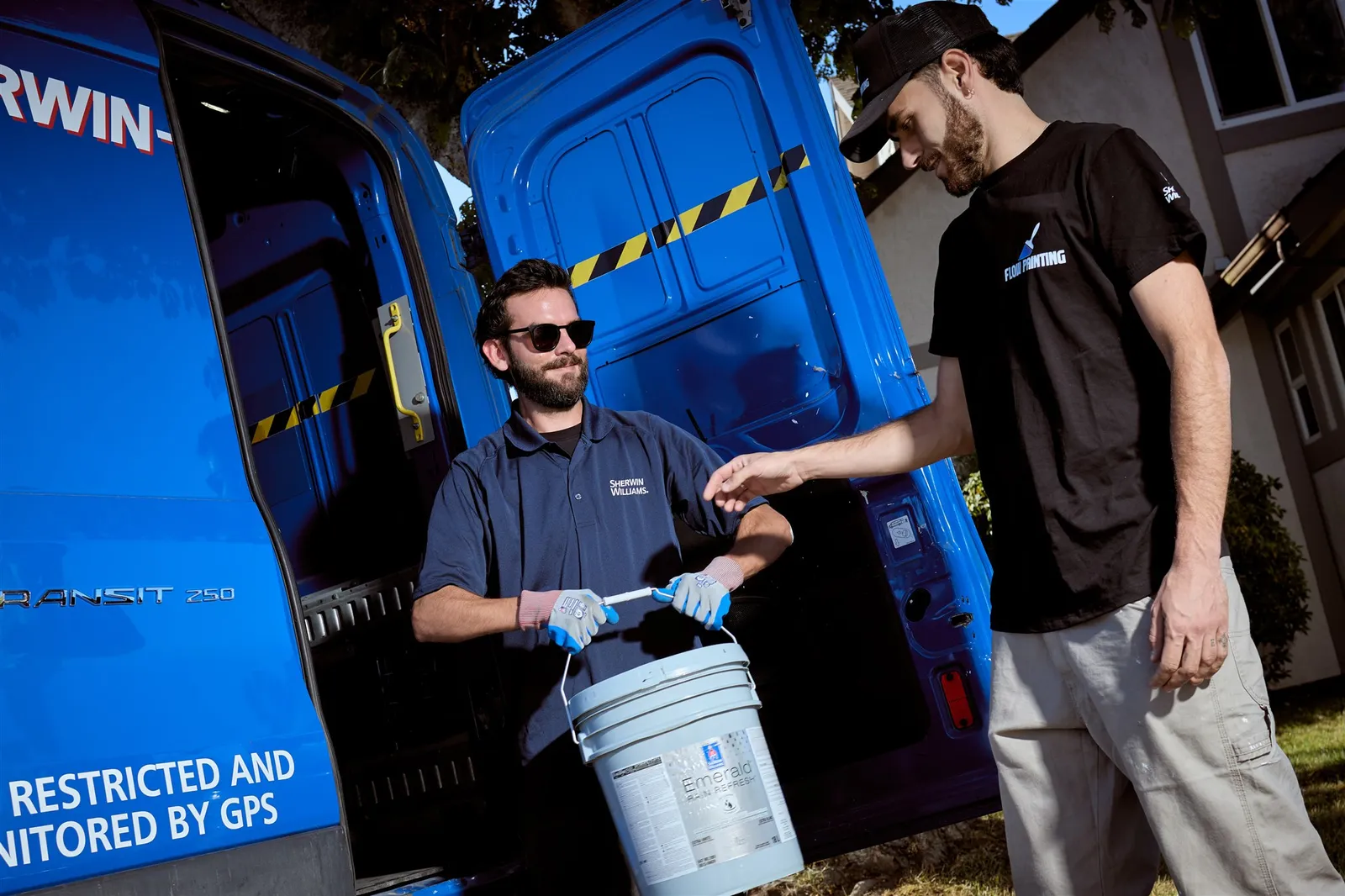 Professional painters working on house exterior painting project in Victoria