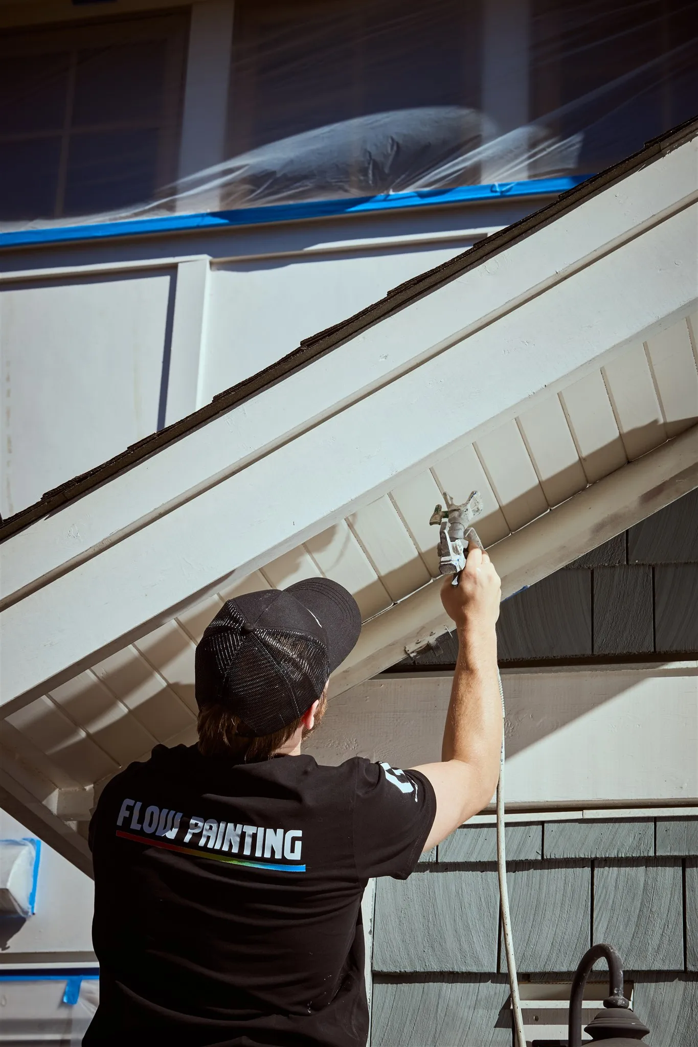 Flow Painting crew applying exterior paint to Victoria BC residential home