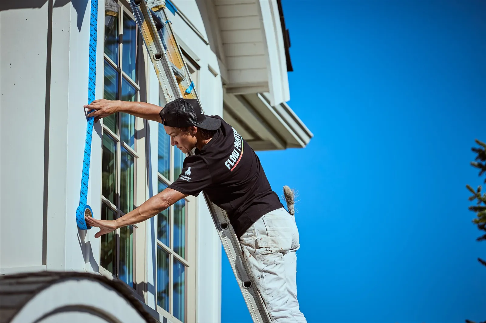 Flow Painting crew applying exterior paint to Victoria BC residential home