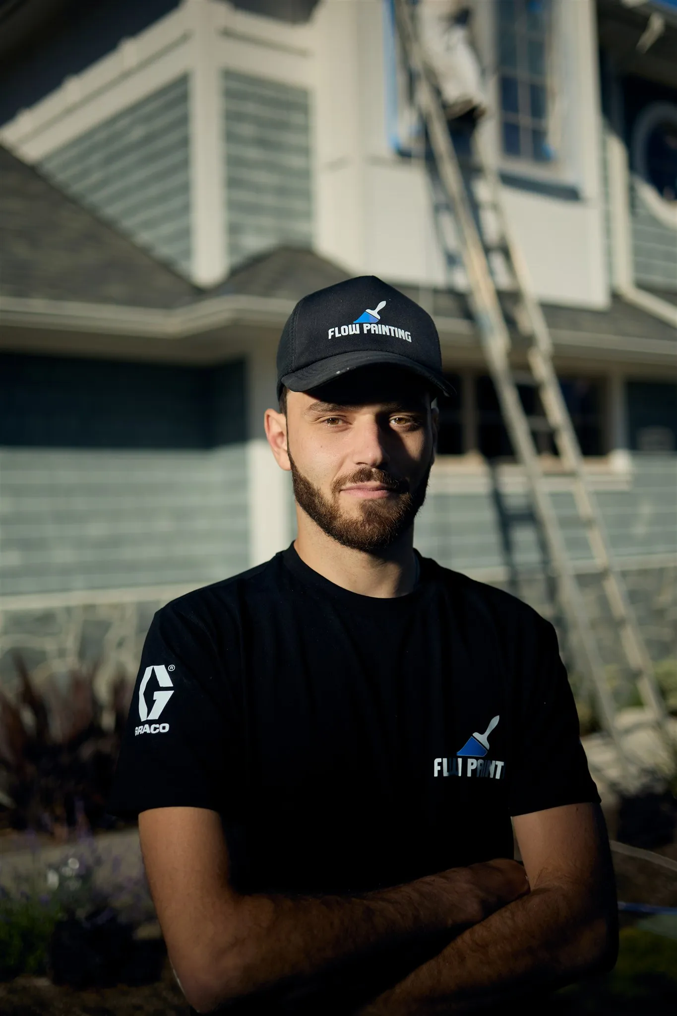 Flow Painting crew applying exterior paint to Victoria BC residential home