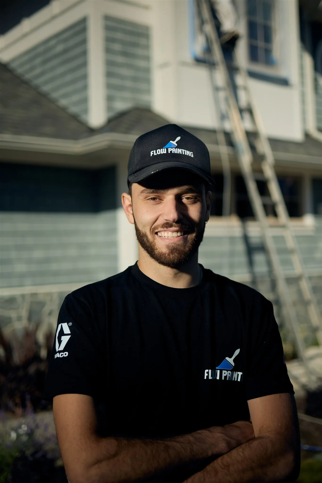 Professional painters working on house exterior painting project in Victoria