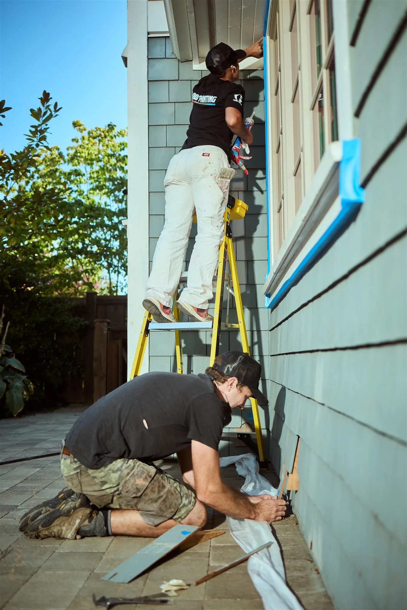 Flow Painting crew applying exterior paint to Victoria BC residential home