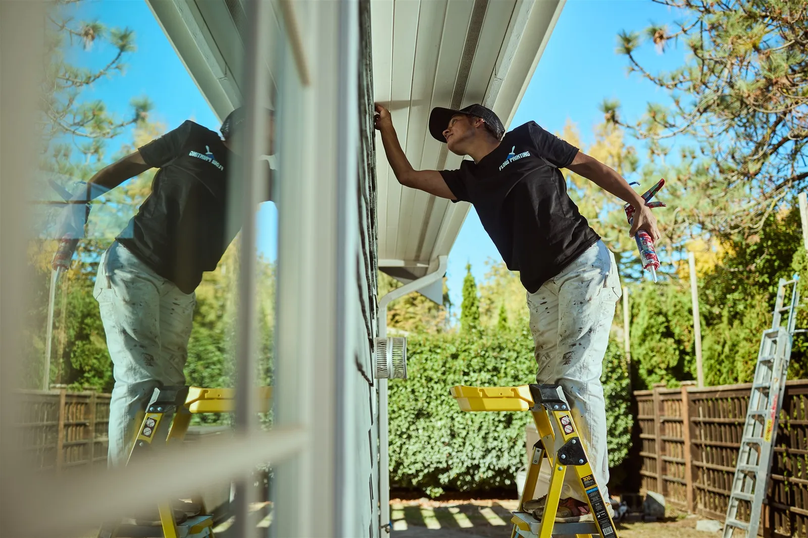 Flow Painting crew applying exterior paint to Victoria BC residential home