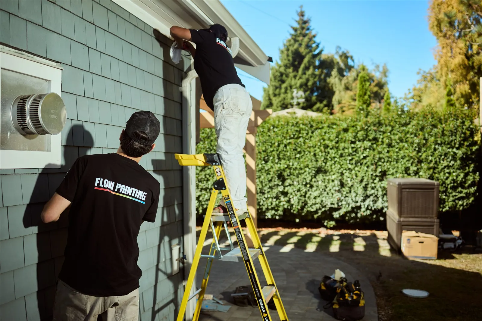 Flow Painting crew applying exterior paint to Victoria BC residential home