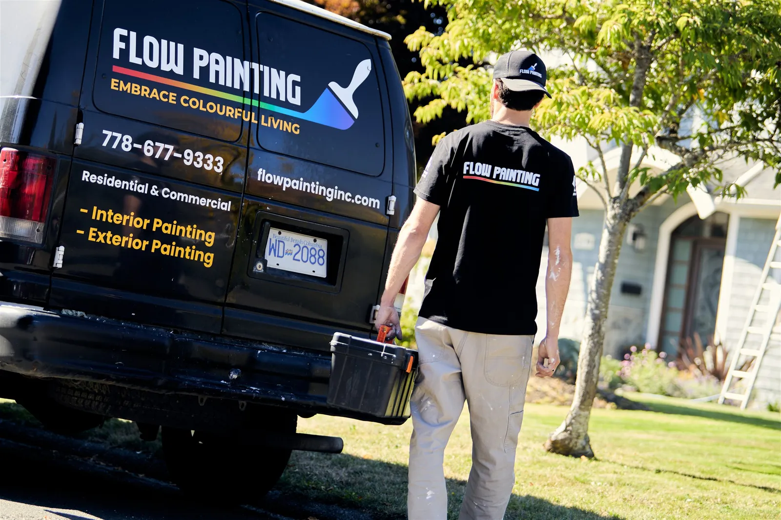 Flow Painting crew applying exterior paint to Victoria BC residential home